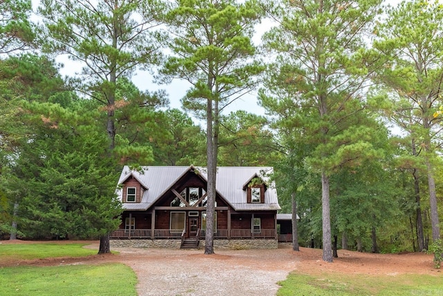 log-style house with a porch