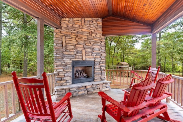 view of patio with an outdoor stone fireplace