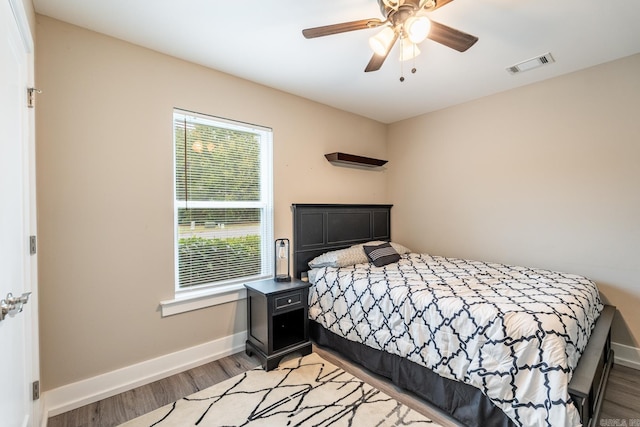 bedroom featuring ceiling fan and light hardwood / wood-style flooring