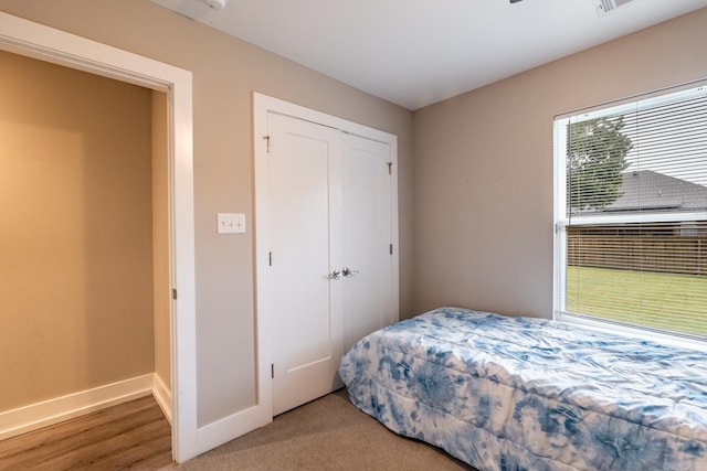 bedroom with hardwood / wood-style floors