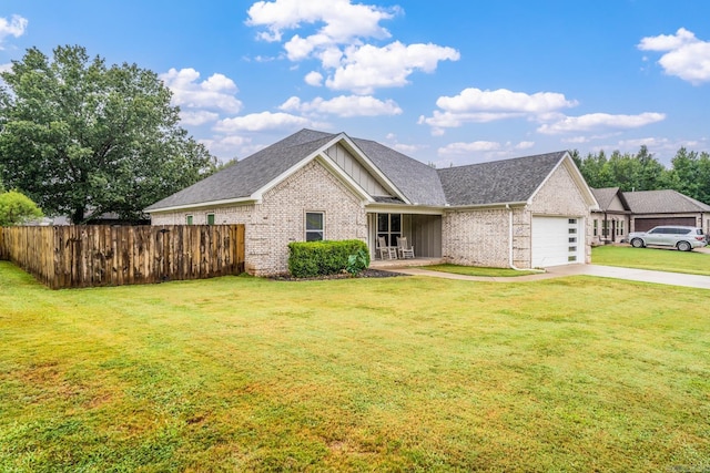 view of front facade with a garage and a front lawn