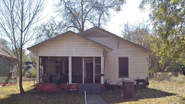 view of front of home featuring a sunroom