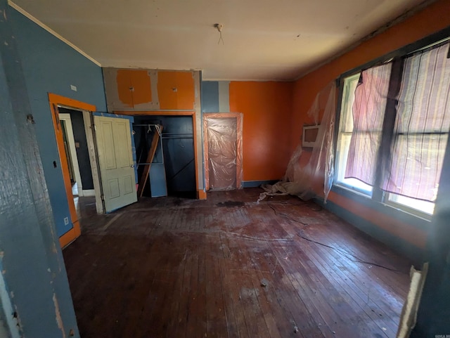 interior space with hardwood / wood-style floors and a closet