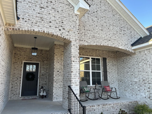 doorway to property featuring a porch