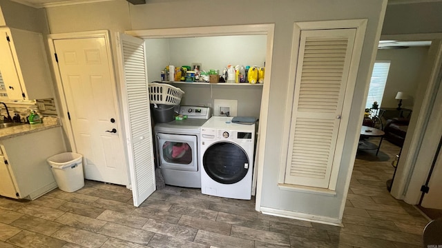 laundry room with washer and clothes dryer and sink