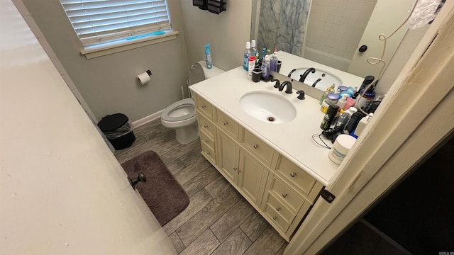 full bathroom featuring shower / bath combo, toilet, and vanity