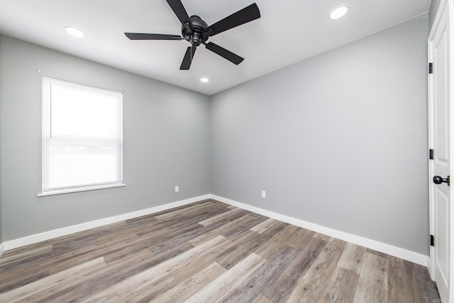 empty room featuring light hardwood / wood-style floors and ceiling fan