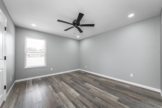 unfurnished room featuring ceiling fan and dark hardwood / wood-style flooring