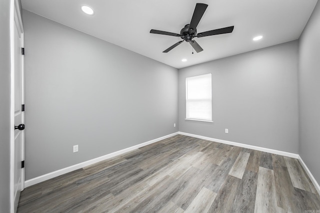 spare room featuring ceiling fan and hardwood / wood-style floors