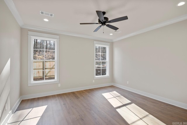 unfurnished room with ceiling fan, wood-type flooring, and ornamental molding