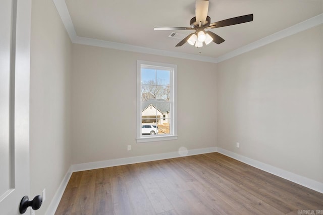 unfurnished room featuring light hardwood / wood-style flooring, ceiling fan, and crown molding