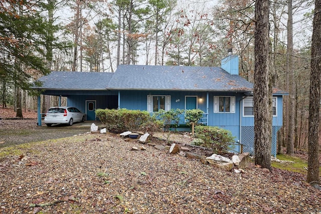 ranch-style home with a carport