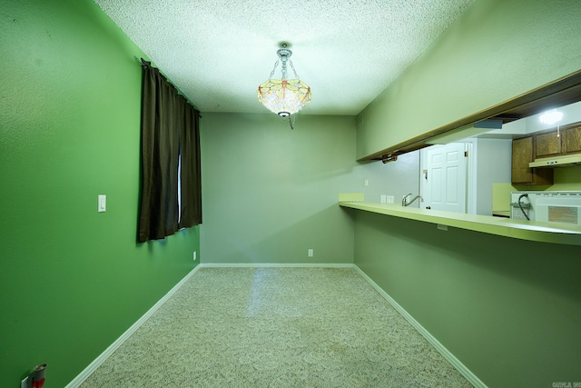 spare room featuring a textured ceiling and sink