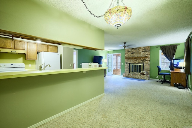 kitchen with white refrigerator, range, light carpet, and a brick fireplace