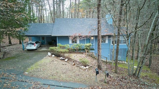 single story home featuring a carport