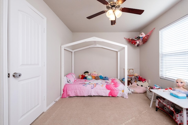 bedroom with carpet, ceiling fan, and multiple windows