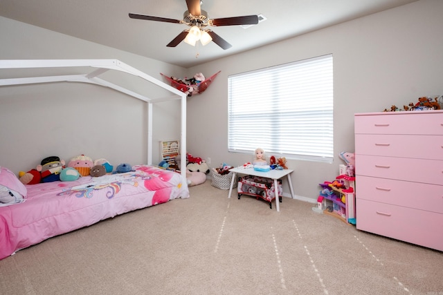 bedroom with ceiling fan, light carpet, and vaulted ceiling