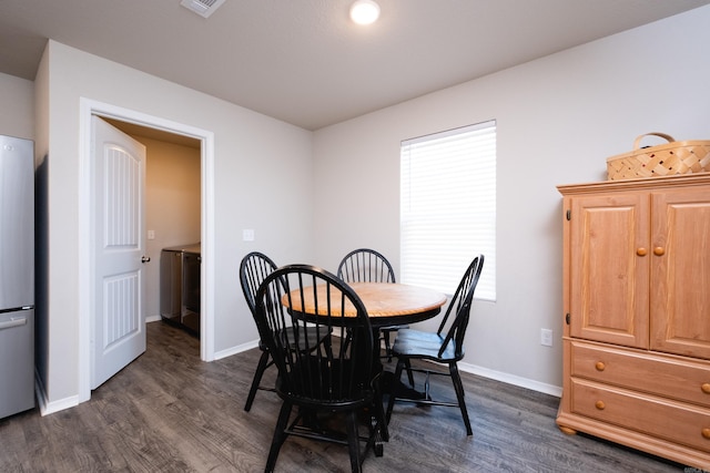 dining room featuring dark wood-type flooring