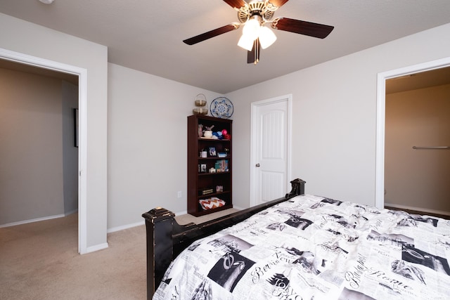 bedroom featuring light carpet and ceiling fan