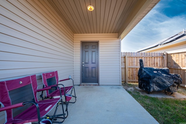 property entrance with a patio