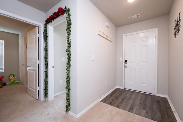 doorway featuring carpet