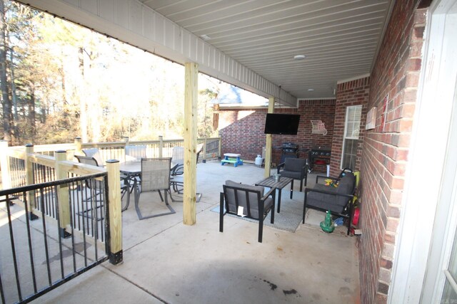 view of patio with a grill