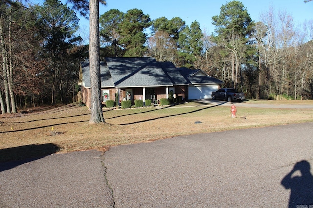 ranch-style house with a front lawn