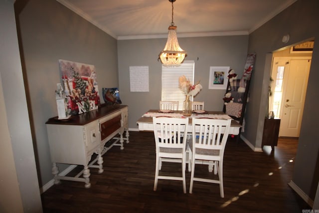 dining room with ornamental molding, dark wood-type flooring, and an inviting chandelier