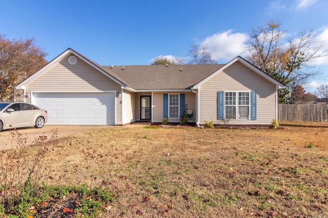 single story home with a garage and a front lawn