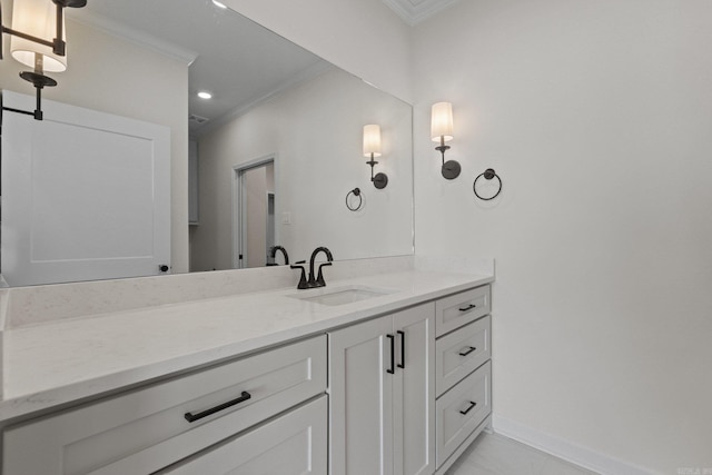 bathroom featuring vanity and ornamental molding