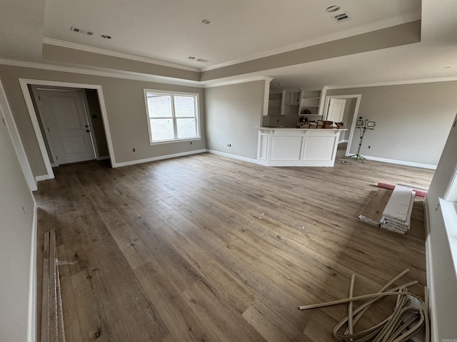 unfurnished living room featuring light hardwood / wood-style floors and crown molding