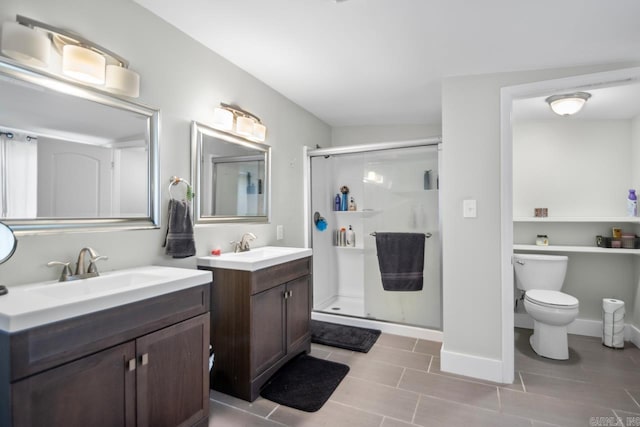 bathroom with toilet, vanity, vaulted ceiling, and walk in shower