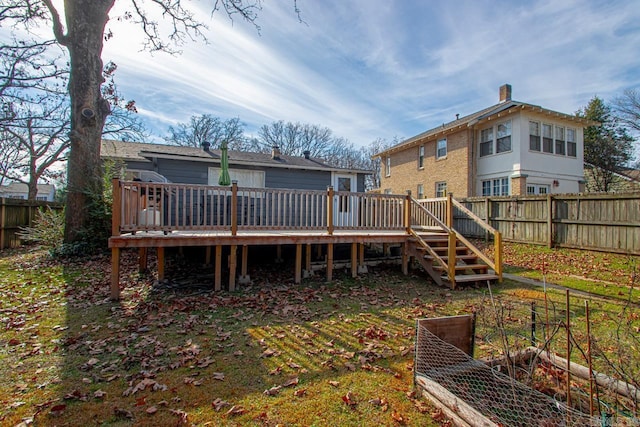 back of property with a wooden deck