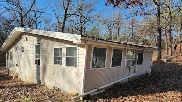 view of home's exterior with cooling unit