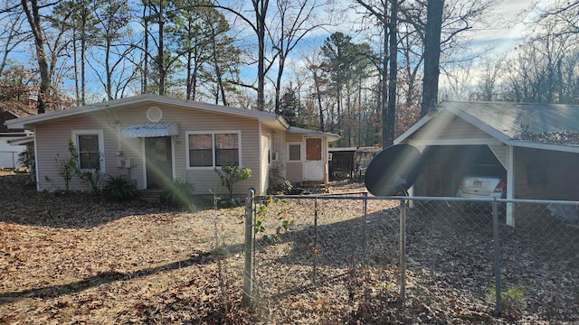 view of home's exterior with a carport