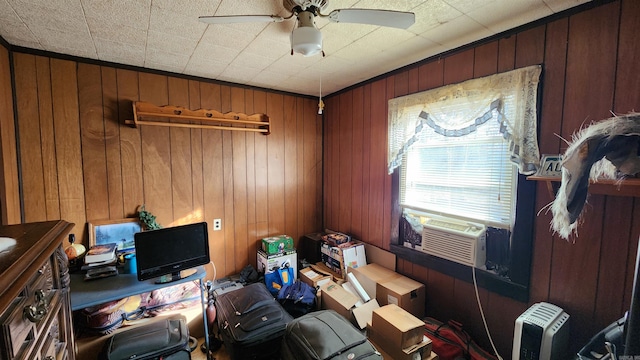 home office featuring ceiling fan, cooling unit, and wooden walls