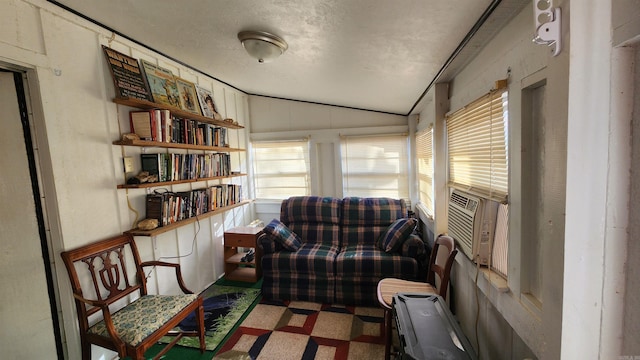 sitting room with vaulted ceiling