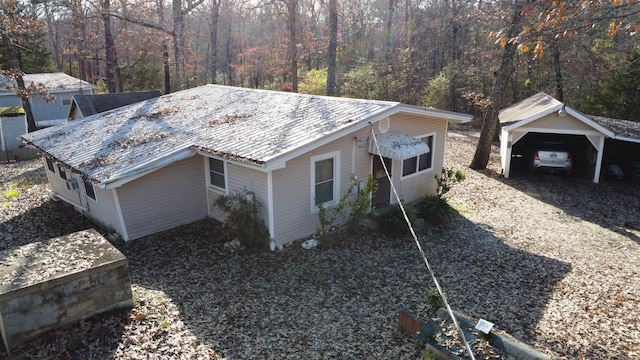 view of home's exterior featuring a garage and an outdoor structure