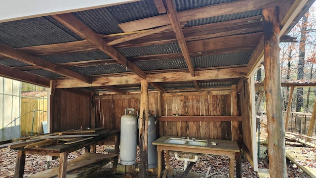 misc room featuring wood walls and plenty of natural light