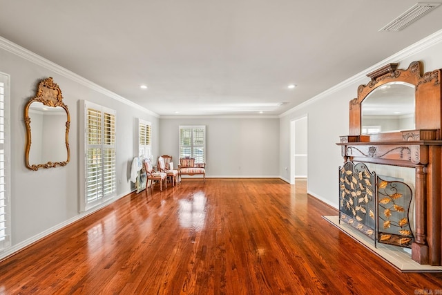 unfurnished room with hardwood / wood-style floors and ornamental molding