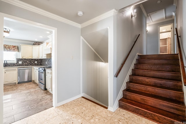 staircase with crown molding and sink