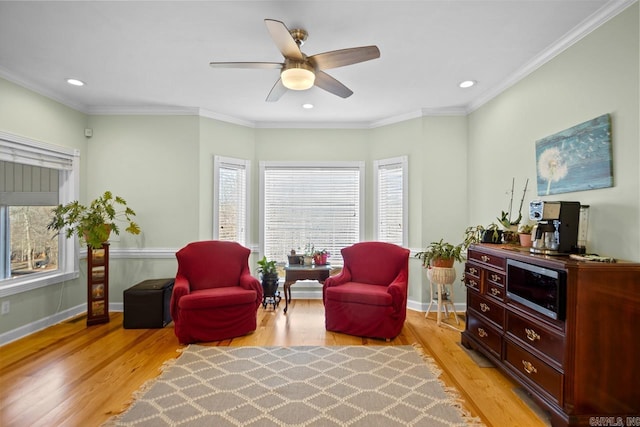 sitting room featuring crown molding, light hardwood / wood-style flooring, and plenty of natural light