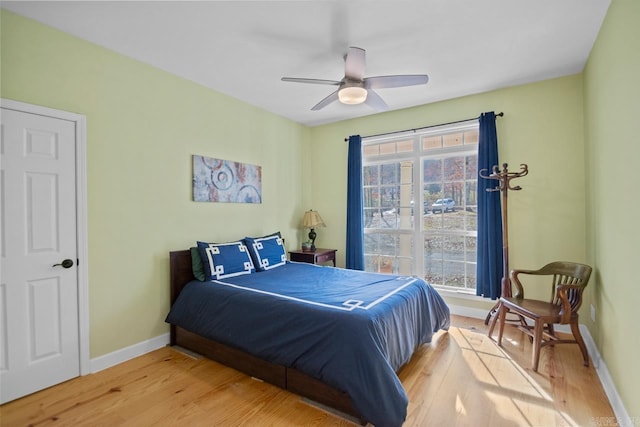 bedroom featuring ceiling fan and light hardwood / wood-style flooring