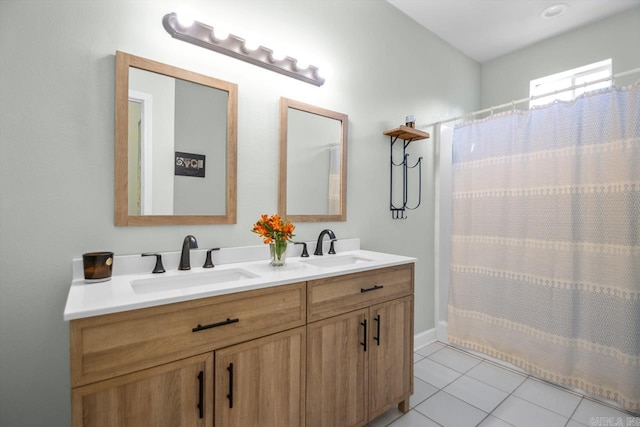 bathroom with a shower with curtain, tile patterned flooring, and vanity