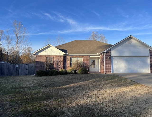 ranch-style house with a front yard and a garage