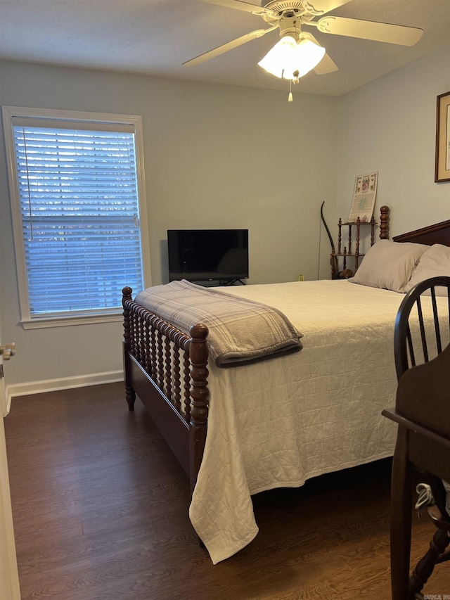 bedroom featuring ceiling fan and dark wood-type flooring