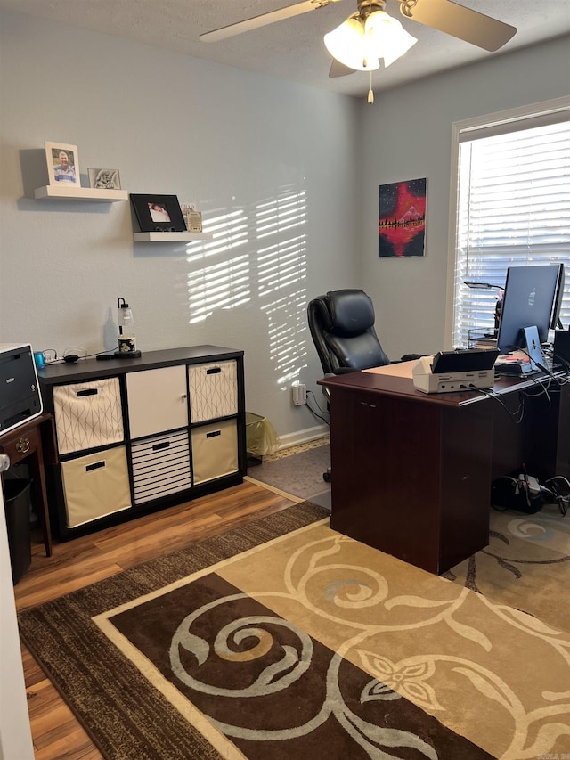 office space featuring ceiling fan and hardwood / wood-style floors