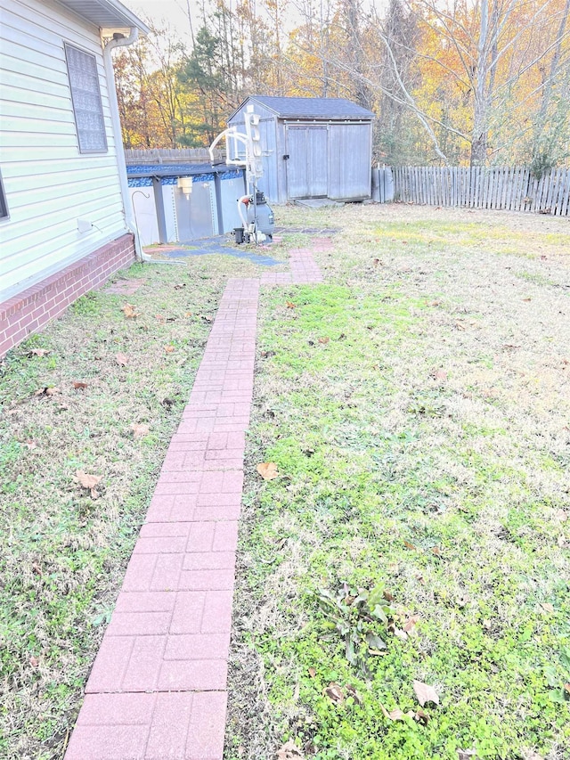 view of yard with a storage unit