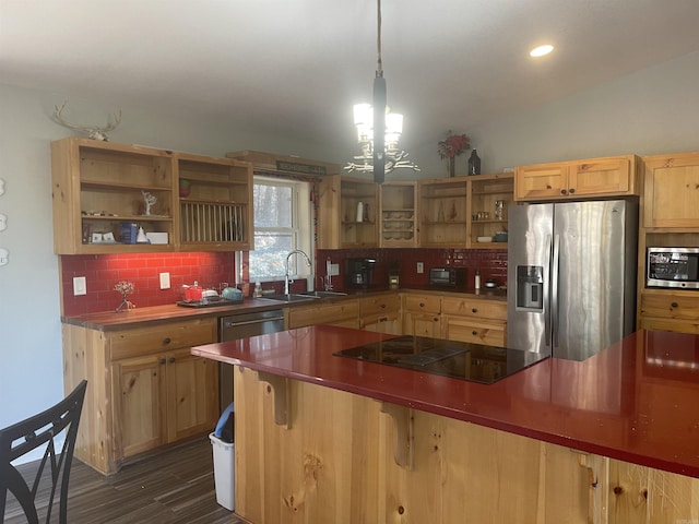 kitchen featuring sink, dark wood-type flooring, stainless steel appliances, decorative light fixtures, and decorative backsplash