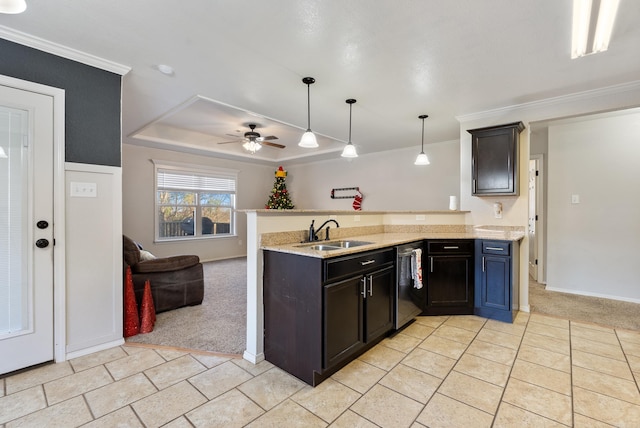 kitchen featuring dishwasher, sink, kitchen peninsula, light colored carpet, and decorative light fixtures